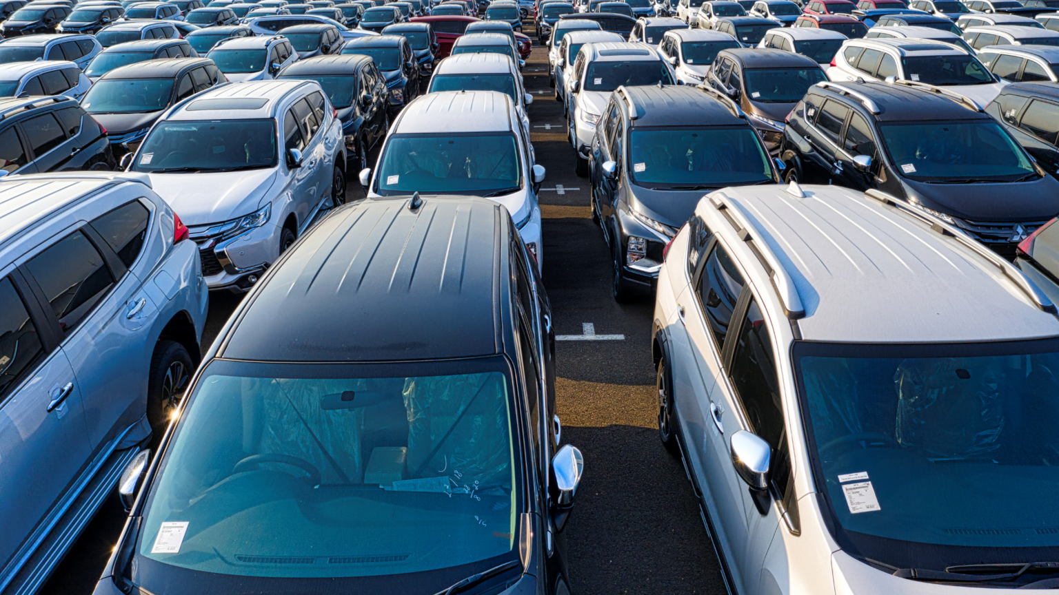 Rows of vehicles in various colours.