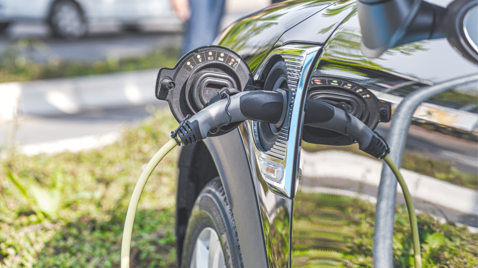 Black Car plugged into charging socket